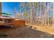 Spacious backyard featuring a deck, fire pit and mature trees at 3041 Mulberry Ln, Lancaster, SC 29720