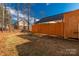 Backyard with wooden fence and mature trees at 3041 Mulberry Ln, Lancaster, SC 29720