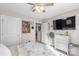 Neutral bedroom featuring a large television, ceiling fan, and natural light at 3041 Mulberry Ln, Lancaster, SC 29720