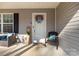 Inviting front porch with chairs and decorations adding a touch of curb appeal to the home at 3041 Mulberry Ln, Lancaster, SC 29720