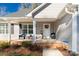 Charming front porch with decorative wreath and sitting area for relaxing and enjoying the outdoors at 3041 Mulberry Ln, Lancaster, SC 29720