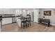 Well-lit kitchen boasts stainless steel appliances, white cabinets, and a breakfast bar with granite countertops at 3041 Mulberry Ln, Lancaster, SC 29720