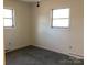 Bedroom featuring two windows and neutral walls at 314 Little St, Lincolnton, NC 28092