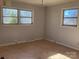 Bedroom with three windows and wood floors at 314 Little St, Lincolnton, NC 28092