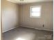 Bedroom featuring striped wallpaper and a window at 314 Little St, Lincolnton, NC 28092
