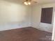 Bedroom featuring hardwood floors, neutral paint, and a ceiling fan at 314 Little St, Lincolnton, NC 28092