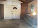 Garage interior featuring a work bench and exterior door at 314 Little St, Lincolnton, NC 28092