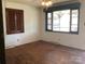 A cozy living room with hardwood floors and a large window at 314 Little St, Lincolnton, NC 28092