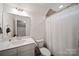 A clean bathroom is equipped with a single sink and walk-in shower at 3899 Center Place Dr, Harrisburg, NC 28075