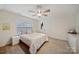 Comfortable bedroom with neutral decor, ceiling fan, carpet and double closet at 3899 Center Place Dr, Harrisburg, NC 28075