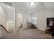 Upstairs bedroom with a window, and steps to the bathroom and loft area at 3899 Center Place Dr, Harrisburg, NC 28075