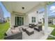 Charming covered patio with ample seating and sliding glass doors, seamlessly blending indoor and outdoor living spaces at 3899 Center Place Dr, Harrisburg, NC 28075