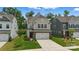 Charming two-story home with a well-maintained lawn and a two-car garage on a sunny day at 3899 Center Place Dr, Harrisburg, NC 28075