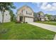 Charming home featuring manicured front yard, large driveway and two-car garage at 3899 Center Place Dr, Harrisburg, NC 28075