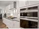Gourmet kitchen with stainless steel appliances, a gas cooktop, double ovens, and stylish finishes at 3899 Center Place Dr, Harrisburg, NC 28075