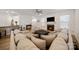 Spacious living area with an open floor plan, fireplace, and comfortable seating arrangement at 3899 Center Place Dr, Harrisburg, NC 28075