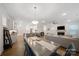 Open living space with a dining area, kitchen with bar seating, and comfortable lounge area at 3899 Center Place Dr, Harrisburg, NC 28075