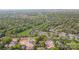 Aerial view of a property nestled in a lush, green neighborhood with city skyline in the distance at 4008 Nettie Ct # 3, Charlotte, NC 28211