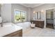 Well-lit bathroom featuring double vanity, soaking tub, and modern fixtures at 4008 Nettie Ct # 3, Charlotte, NC 28211