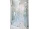 Beautiful glass shower with marble tiling, built-in bench, and modern fixtures at 4008 Nettie Ct # 3, Charlotte, NC 28211