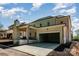Rear exterior of home featuring a brick facade, covered porch, and attached garage at 4008 Nettie Ct # 3, Charlotte, NC 28211