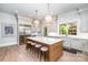 Spacious kitchen with large center island, modern appliances, and custom cabinetry at 4008 Nettie Ct # 3, Charlotte, NC 28211