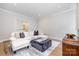 Cozy living room featuring a white sofa, ottoman coffee table, and hardwood floors at 4008 Nettie Ct # 3, Charlotte, NC 28211