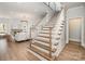 Elegant staircase features beautiful wood treads and bright white risers at 4008 Nettie Ct # 3, Charlotte, NC 28211