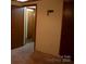 Empty bedroom with multiple closets and doors at 522 Perry St, Troy, NC 27371