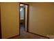 Neutral bedroom features carpet and light fixture at 522 Perry St, Troy, NC 27371