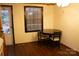 Bright kitchen nook with wood flooring, and a small table with seating for casual dining at 522 Perry St, Troy, NC 27371