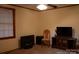 Living room with window and entertainment center at 522 Perry St, Troy, NC 27371