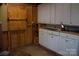 Shed interior with wood walls and cabinets at 522 Perry St, Troy, NC 27371