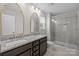 Bathroom with double vanity, granite countertops, and glass shower at 531 Harlech Ct, Fort Mill, SC 29715