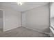 Neutral carpeted bedroom featuring natural light from a window at 531 Harlech Ct, Fort Mill, SC 29715