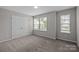 Bedroom with carpet, double door closet, and natural light streaming through the windows at 531 Harlech Ct, Fort Mill, SC 29715