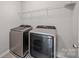 Laundry room equipped with modern washer and dryer units at 531 Harlech Ct, Fort Mill, SC 29715