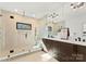 Luxurious bathroom featuring glass enclosed shower, double vanity, and modern lighting at 5520 Chedworth Dr, Charlotte, NC 28210