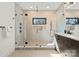 Modern bathroom boasting glass enclosed shower, neutral tile, and updated vanity at 5520 Chedworth Dr, Charlotte, NC 28210