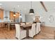 Open dining room with a view into the modern kitchen and stainless steel appliances at 5520 Chedworth Dr, Charlotte, NC 28210