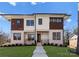 Modern two-story home featuring a brick facade, dark trim, and a well-manicured lawn at 5520 Chedworth Dr, Charlotte, NC 28210