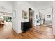 Bright foyer boasts hardwood floors, modern staircase, and stylish decor, creating a welcoming entrance to the home at 5520 Chedworth Dr, Charlotte, NC 28210