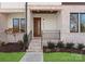 Welcoming front entrance with brick steps and modern door, complemented by a neatly landscaped yard at 5520 Chedworth Dr, Charlotte, NC 28210