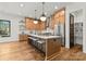 Spacious kitchen with a large island, stainless steel appliances, and wooden cabinets at 5520 Chedworth Dr, Charlotte, NC 28210
