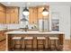 Modern kitchen island with pendant lighting, counter seating, and ample storage space at 5520 Chedworth Dr, Charlotte, NC 28210