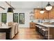 Open concept with hardwood floors and a kitchen with stainless steel appliances at 5520 Chedworth Dr, Charlotte, NC 28210