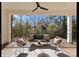 Outdoor living space with comfortable seating, modern design, and a view of the surrounding greenery at 5520 Chedworth Dr, Charlotte, NC 28210