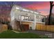 Stunning two-story home with a spacious garage, stylish balconies, and well-maintained lawn at 5520 Chedworth Dr, Charlotte, NC 28210