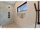 Contemporary shower with tiled walls, a window, and modern black fixtures at 5520 Chedworth Dr, Charlotte, NC 28210