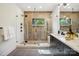 This bathroom features a glass enclosed shower, modern tiling, and sleek fixtures at 5610 Farmbrook Dr, Charlotte, NC 28210